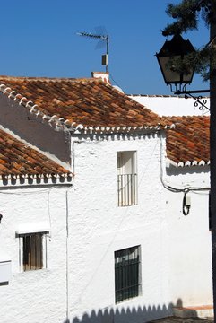 Townhouses along a village street, Macharaviaya, Andalusia, Spain.