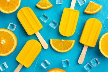  Ice lollies with orange flavour and ice cubes © FreepikCompany