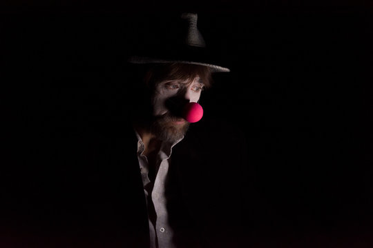 Sad Clown. Studio portrait in low-key light