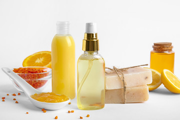 Natural cosmetics with ingredients on white background