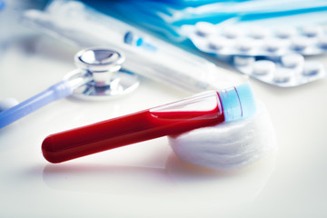 A test tube with a blood test in a medical laboratory. Background with copy space. Horizontal.