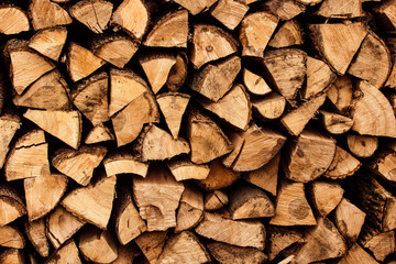 firewood stacked near the wall close-up