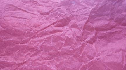 Fototapeta premium Crumpled paper with a pink texture. Texture of crumpled paper. Crumpled paper. Paper wrinkles