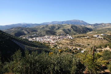 Fototapeta na wymiar View of whitewashed village (pueblo blanco) and surrounding countryside, Algarinejo, Andalusia, Spain.