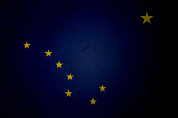 Flag of alaska, USA, on a grunge metal texture