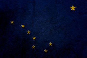 Flag of alaska, USA, on a grunge metal texture