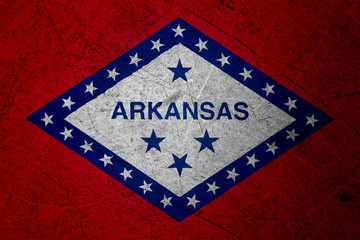 Fototapeta na wymiar Flag of arkansas, USA, on a grunge metal texture
