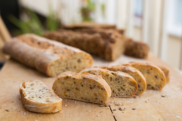 fresh loaf of bread on wooden board
