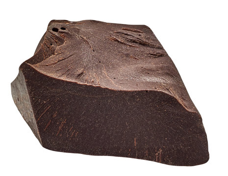 Cracked couverture chocolate / broken chocolate chip or chocolate part from top view isolated on white background including clipping path.