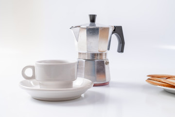 coffee maker white breakfast cup and cookies on background