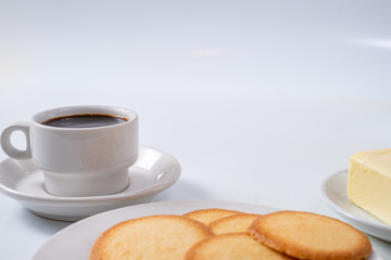 cup of coffee with cookies on background