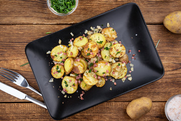 Fried Potatoes on a wooden table (selective focus)
