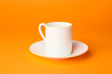 Blank cup on color background