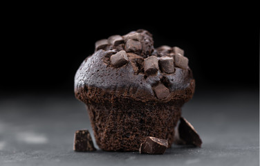 Some Chocolate Muffins (close-up shot; selective focus)
