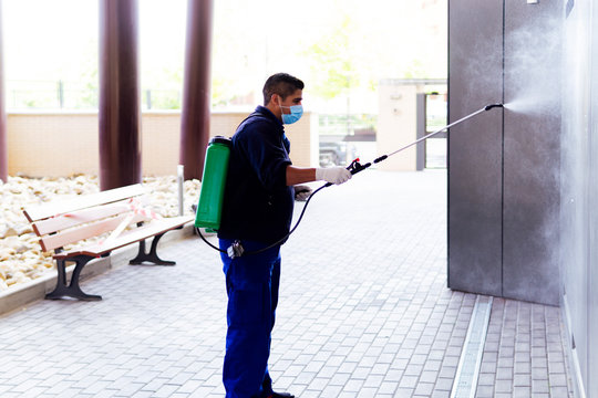 coronavirus. maintenance personnel disinfecting to prevent the spread of covid19