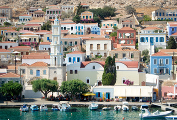 The Greek holiday island of Halki.  A view of the bay at the port of Emborio.  Pleasure boats are...