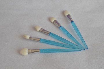 Makeup brush on a white background. The view from the top. 
