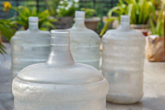 Empty used plastic canister bottles for water dispenser
