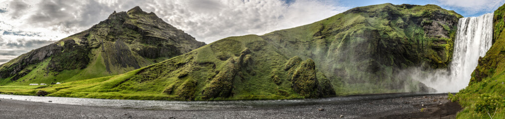 Spectacular Skogafoss Waterfall during a summer day