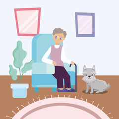 old man in the living room with a dog