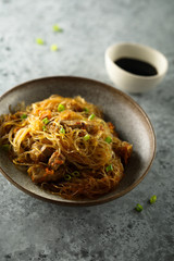 Fried rice noodles with chicken and vegetables