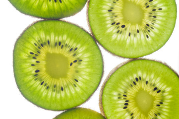 round kiwi slices on a white background. Isolated on white