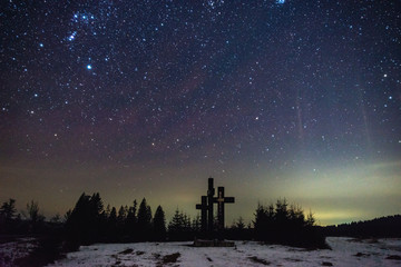 This photo is taken in the mountains near Mirecurea Ciuc, Romania.   Three Holy Crosses in Harghita