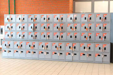 individual metal lockers with keys for storing personal belongings.