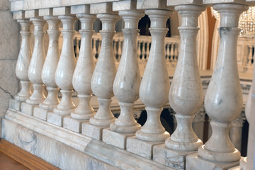 Balusters made of white marble. fragment of the interior of classical architecture close-up.
