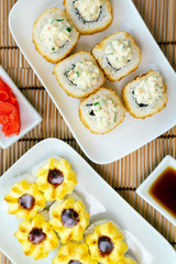 Close-up view of Japanese sushi roll with tempura shrimp. Deep-fried vertical photo. for two persons