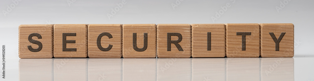 Aufkleber Security word on wooden cube blocks on white grey glossy background