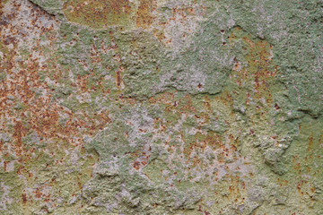 Old rusted weathered and uneven stone wall texture background or backdrop