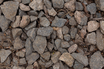 Big cobbles, cobblestones on the ground. Texture background or backdrop.