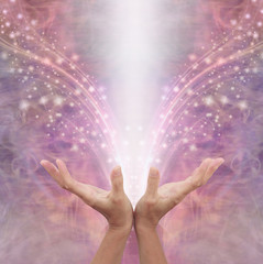 Sending out Reiki healing energy across the ether - female with open hands beaming out white energy...