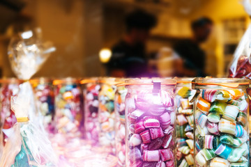 Blur background of delicious sweet beautiful fantasy colourful jar box of candy treat for summer holiday kids gift souvenir. Eat too much bonbon lollipop sugar is toxic unhealthy nutrition addiction