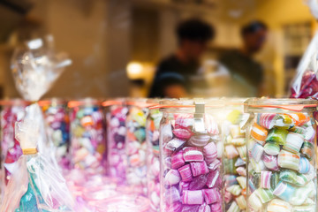 Blur background of delicious sweet beautiful fantasy colourful jar box of candy treat for summer holiday kids gift souvenir. Eat too much bonbon lollipop sugar is toxic unhealthy nutrition addiction