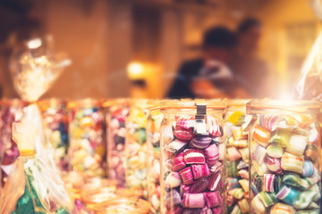 Blur background of delicious sweet beautiful fantasy colourful jar box of candy treat for summer holiday kids gift souvenir. Eat too much bonbon lollipop sugar is toxic unhealthy nutrition addiction