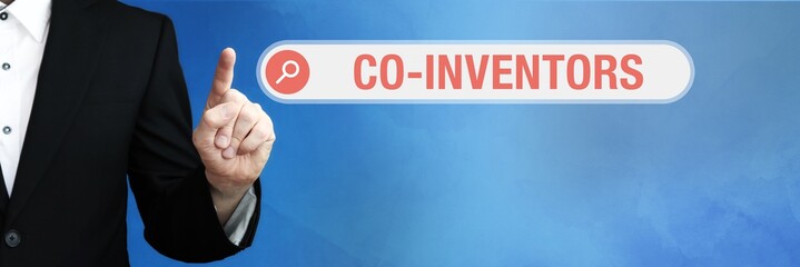 Co-Inventors. Lawyer in suit points with his finger to a search box. The term Co-Inventors is in...
