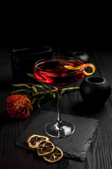 Сocktail on a black decor background