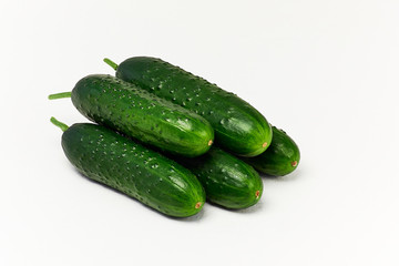 Cucumbers on white background. Fresh green raw cucumbers close up.