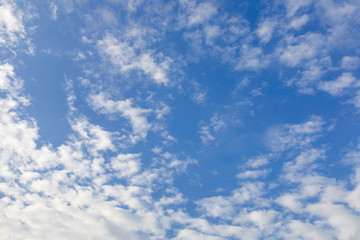 Blue sky with white clouds background.