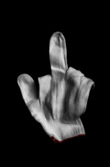 Glove made of white fabric on a black background. International signs and symbols. Youth symbols. Common gestures. Gestures with his fingers. International gestures. Sign language. The youth gestures.