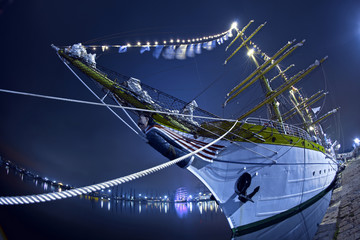 Sailing ship tied to a pier, shot with a fish eye lens.