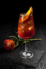 Сocktail on a black decor background