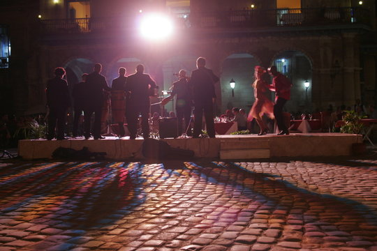 Silhouette of Street Cuban Musicians and Dancers night in Old Havana, Cuba