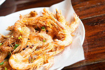 Deep fried shrimp asia style true exotic Thai traditional local food culture fresh natural prawns marinate with organic healthy chili, salt, pepper. Delicious crispy, spicy authentic seafood meal