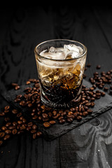 Сocktail on a black decor background