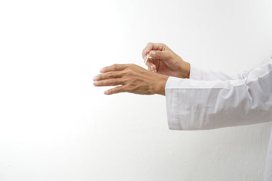 Man sweep the Arabic perfume on the skin