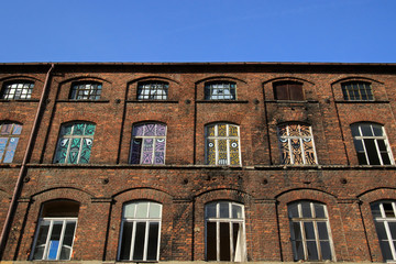 Fototapeta premium Old historic factory buildings in Off Piotrkowska area, Lodz, Poland