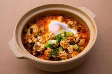 Korean spicy silken tofu stew which is called Sundubu Jjigae